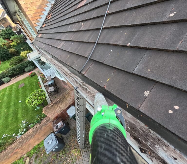 Gutter cleared and clean after cleaning, slate roof