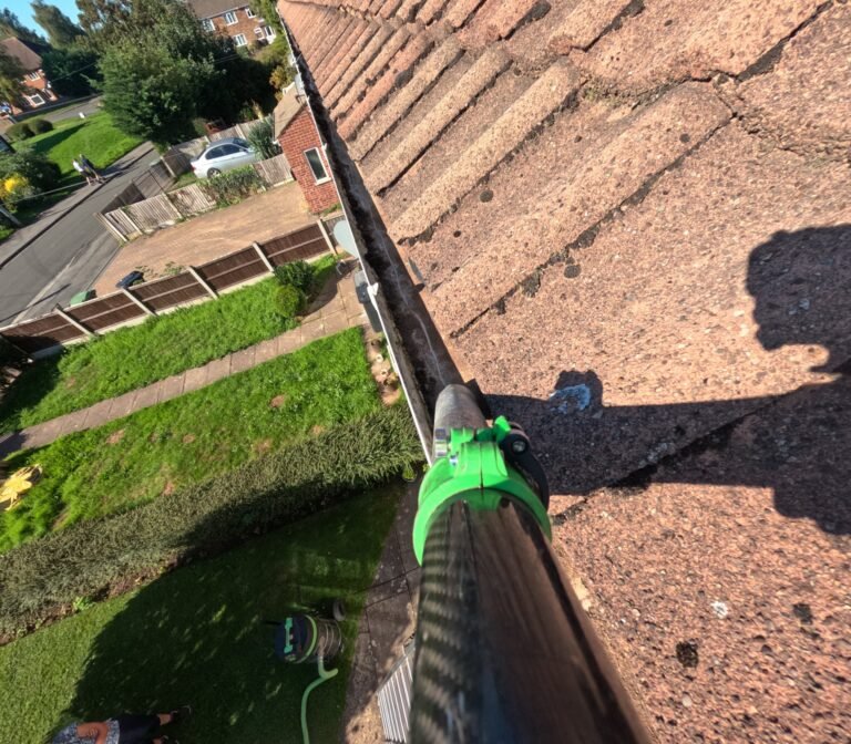 Gutter cleared of moss after cleaning, concrete tile roof, GoPro footage